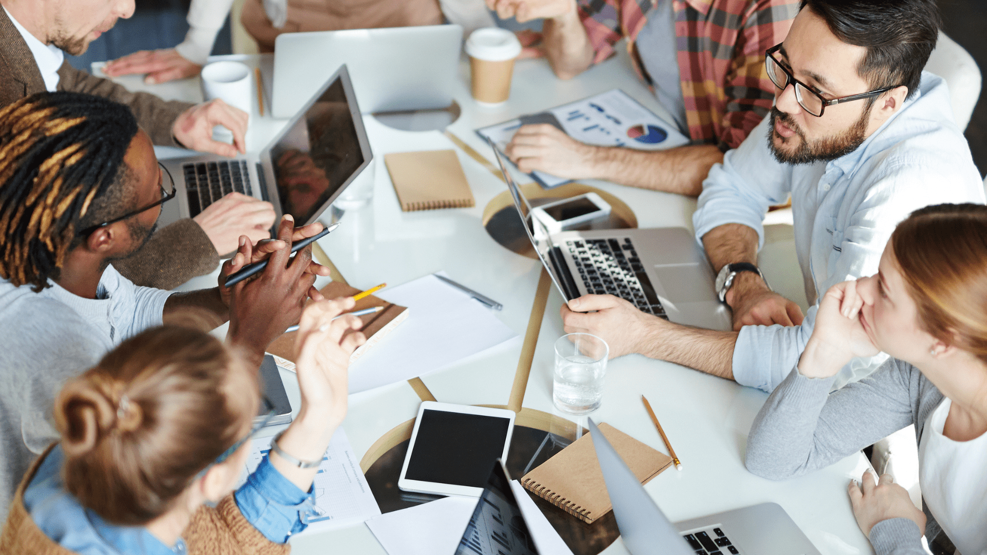 office training at a table with lots of people