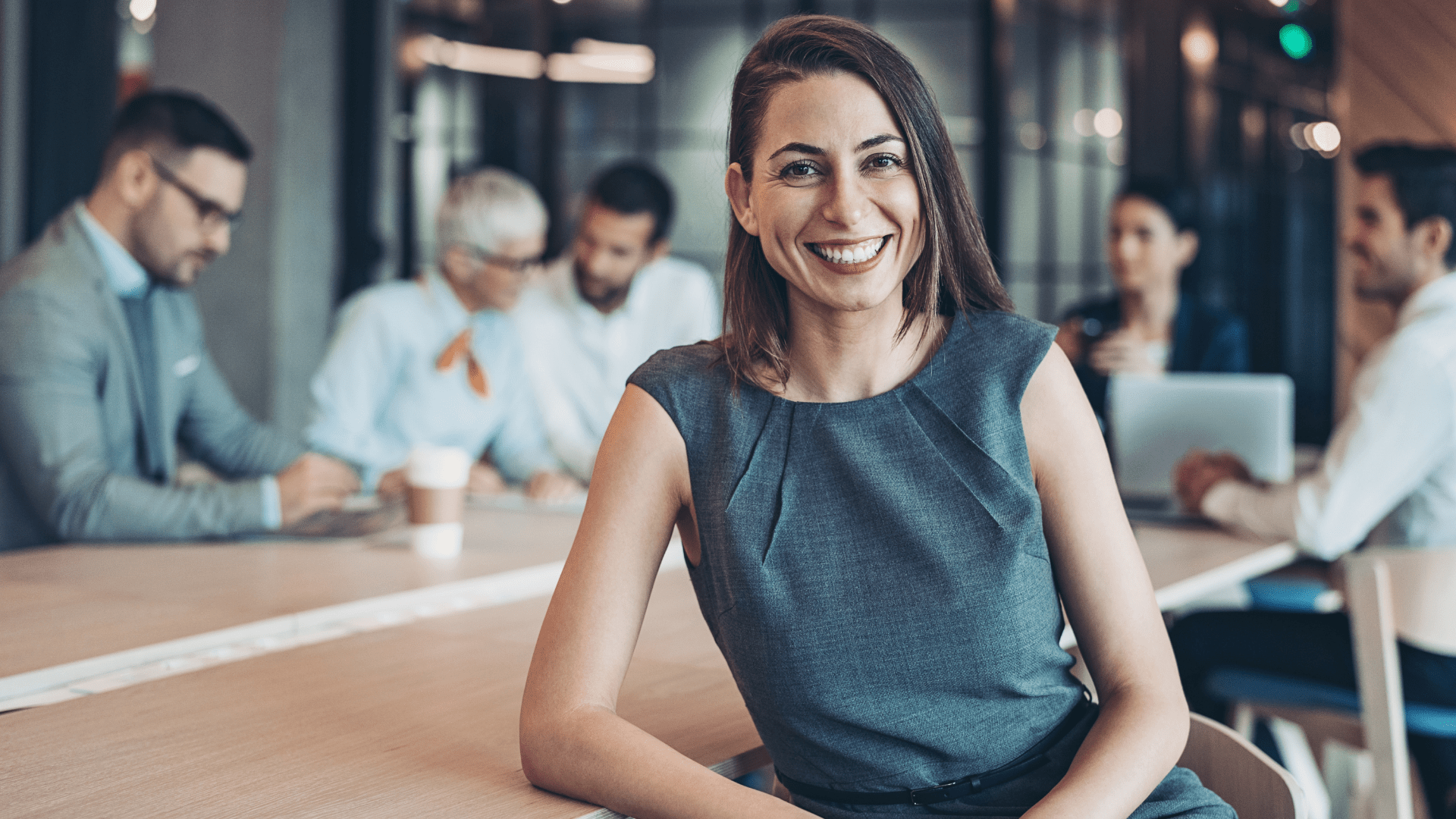 business leader standing in a modern office environment